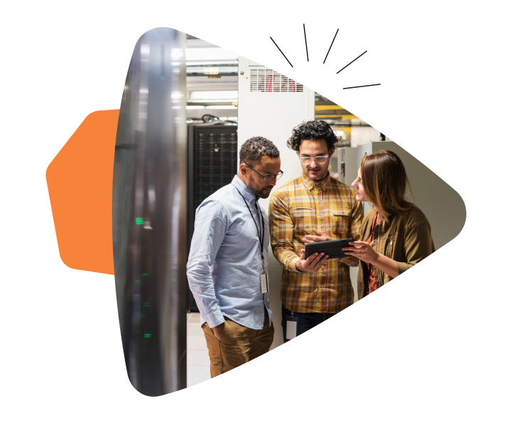 Three adults talking while the middle one is holding a tech device